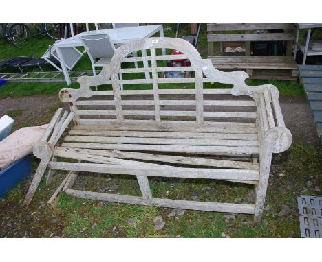 A wooden garden bench, a/f, 65" wide x 41" high.