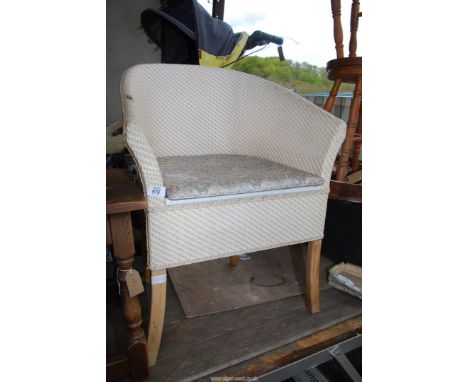 A Lloyd Loom style commode.