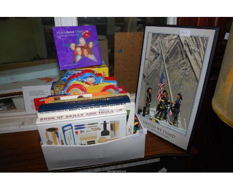Children's books and a print of 9-11 heroes.