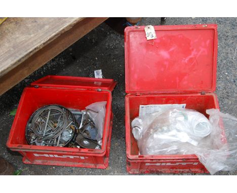 Two boxes of water downspout fittings, a tub of large bolts, screws, large spanner, etc.