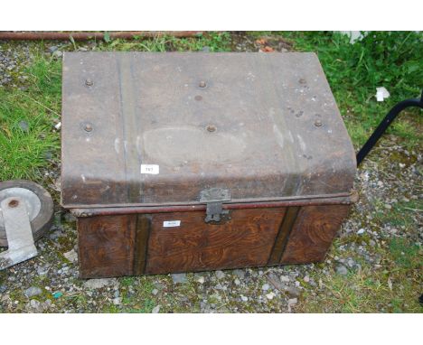 A metal trunk with contents - hand basin brackets, fire extinguisher multi purpose, rodent trap.