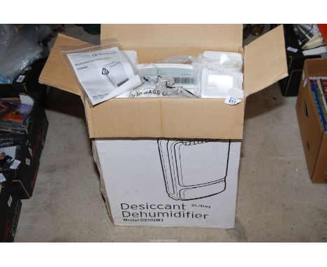 A Rotary Desiccant Dehumidifier DEHUM 3 with instructions.