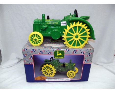 A boxed John Deere collectors cookie jar as a tractor 