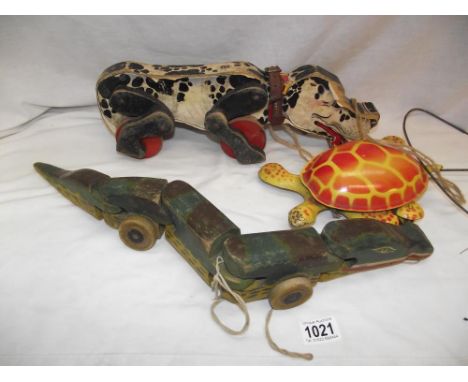 Early Wooden Fisher Price Snoopy dog, Mobo pressed steel tortoise and a wooden pull along articulated crocodile 