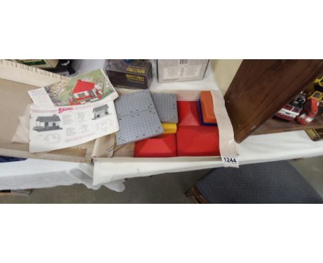 A box of vintage Bayko building set parts 