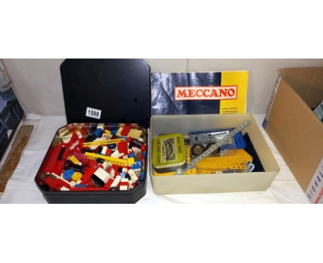 A tub of vintage Meccano and tin of vintage Lego 