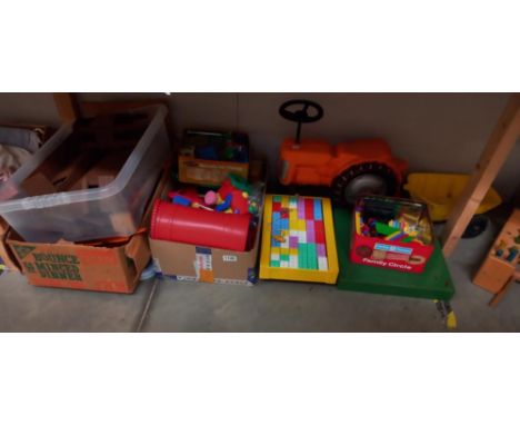 A vintage unnamed toddlers ride on tractor with trailer  possibly Tri-ang plus quantity of other toys including stickle brick