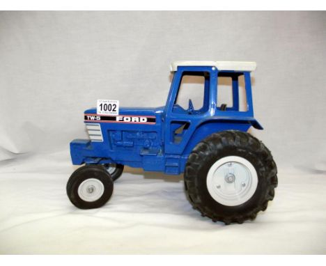 A large scale ERTL diecast Ford TW-5 tractor 