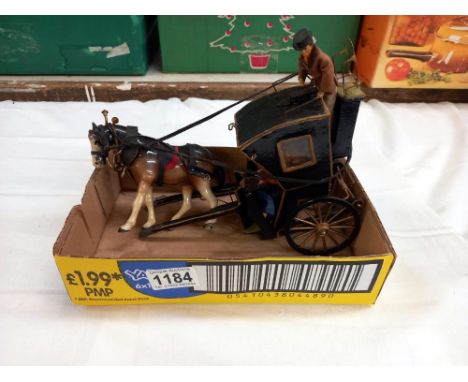 A vintage scratch built model of a Victorian handsom cab with pottery horse 