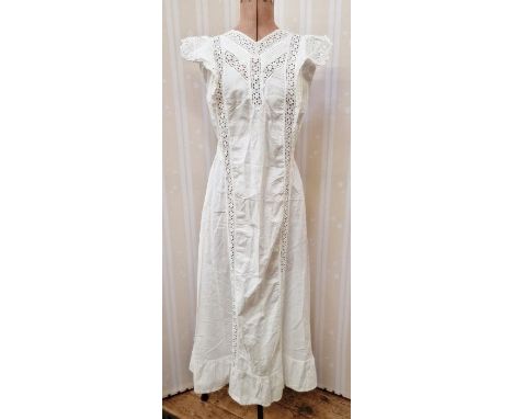 An Edwardian pinafore dress trimmed with embroidery anglaise, and tie fastening at the back, a Victorian nightgown embroidery