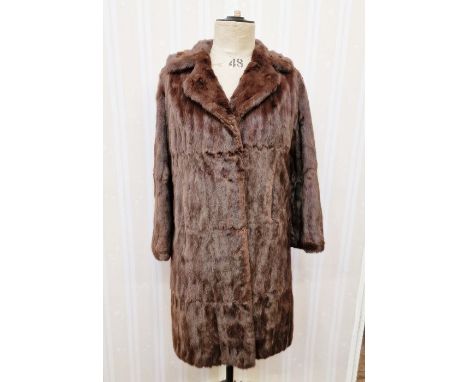 A vintage squirrel coat with embroidered satin lining, a short vintage fur cape labelled "Bobbys", a vintage mink stole (3)
