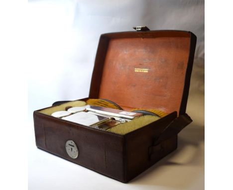 A leather travelling case, initialled CBB, with silver mounted fittings, Mappin & Webb, 29.5 cm wide