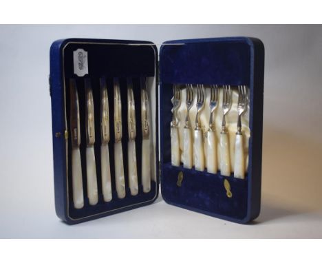 A set of six silver and mother of pearl fruit knives and forks, Mappin & Webb, Sheffield 1935, cased, eleven Norwegian silver