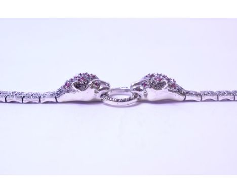A silver, ruby and marcasite panther bracelet   Condition report  Modern