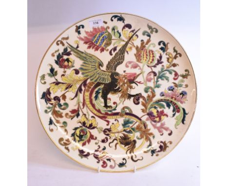 A Zsolnay Pecs pottery charger, decorated a bird and foliage, impressed 1414, some crazing, 40 cm diameter 
