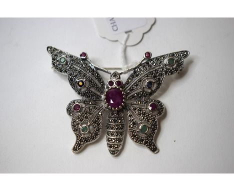 A silver, ruby, emerald and sapphire butterfly brooch   Condition report  Modern