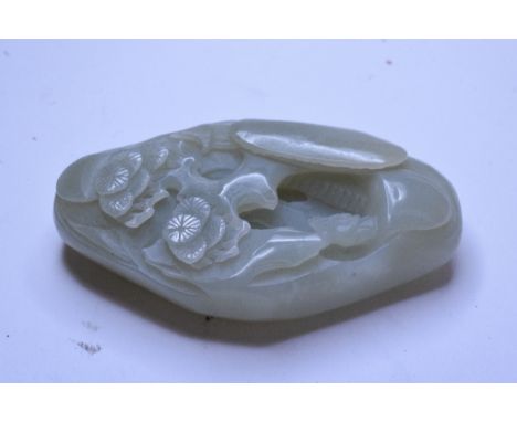 A jade pebble, carved a scholar in a landscape, 8 x 5 cm 