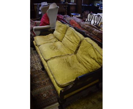 A Bergere three seater sofa, with black chinoiserie style decoration, having double caned sides, and single caned backs, on d