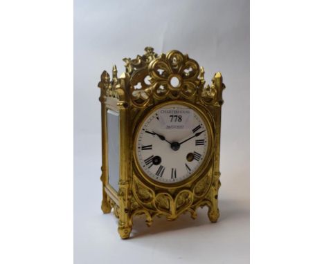 A carriage clock, the 8 cm diameter enamel dial with Roman numerals, fitted an eight day movement striking on a bell, in a br