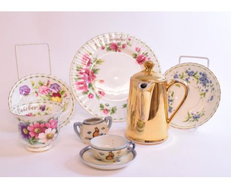 A collection of Royal Albert Months of the Year trios, other ceramics, glass, a mahogany writing slope, a mantel clock and ot