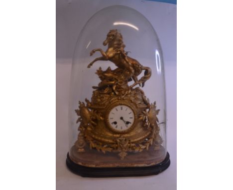 A 19th century French figural mantel clock, 22 cm high with a 7.5 cm diameter dial, under a glass dome, 35 cm wide   Conditio