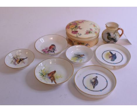 A Royal Worcester dish, painted a bullfinch, indistinctly signed, 8.5 cm diameter, others similar, a Royal Worcester blush iv