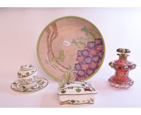 A Crown Ducal Charlotte Rhead charger, decorated flowers, 32 cm wide, a cranberry glass decanter and stopper, with gilt decor