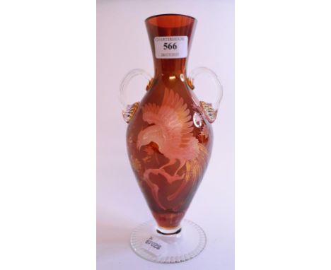 A ruby and clear glass vase, decorated a bird of paradise type bird and foliage, 25 cm high