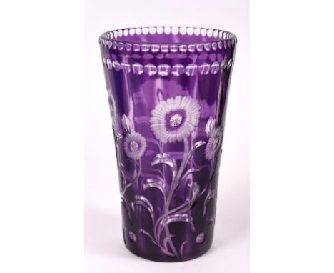 An amethyst and clear glass vase, of tapering form, with intaglio cut decoration, with flowers, probably Stevens & Williams, 