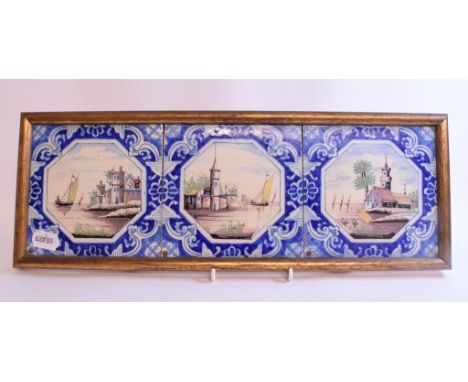 Three Delft tiles, decorated landscapes in polychrome colours, framed as one, a Bacchus type mug, a Chinese porcelain tea cad