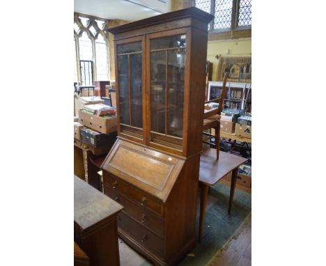 An oak bureau bookcase, 98 cm wide, a standard lamp, a pine box seat, a pier mirror, a firescreen, and a mahogany cabinet (6)