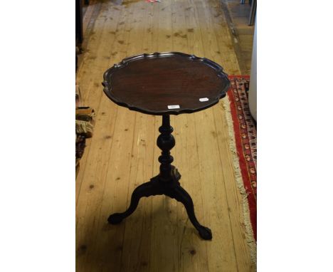 A mahogany tripod table, a pie crust top, on ball and claw feet, 47 cm diameter    Condition report  Report by GHOne leg is s