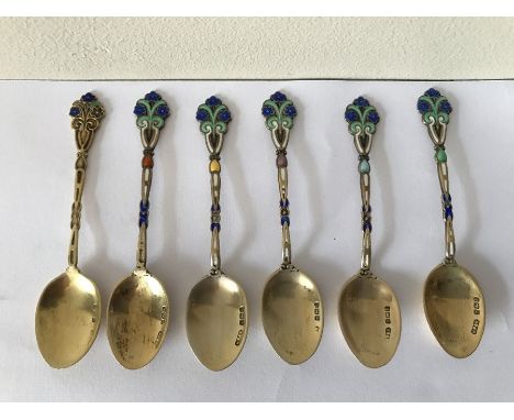 Six silver and enamel coffee spoons, Birmingham 1929. 45 gms weight. Condition ReportSome enamel a/f.