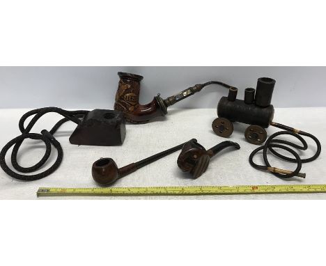 A collection of 5 smoking pipes, 1 carved bowl of stag deer 1820, mother of pearl stem, horn mouthpiece with wear holes, a wo