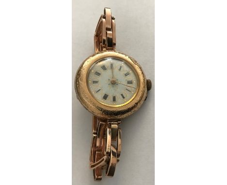 Ladies enamel faced yellow metal cased wristwatch, case marked 14K, expanding bracelet marked 9ct. 33.4gms total. 