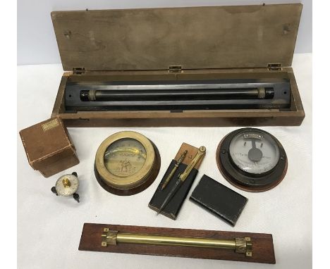 Selection of shipping instruments, military issue boxed parallel rolling ruler, a brass rolling rule, clinometer Liverpool an