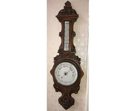 Oak cased aneroid barometer. 95cms h. 