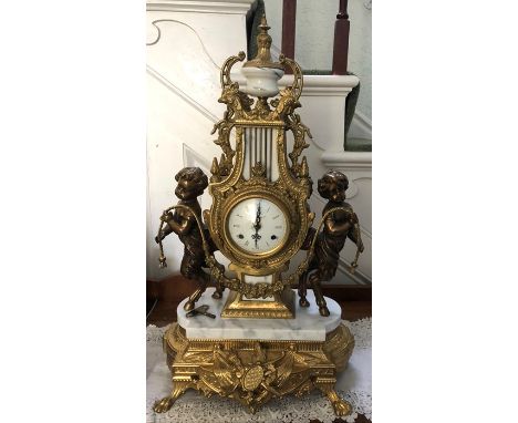 A decorative Italian marble &amp; brass mantle clock. 