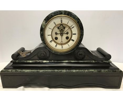 A 19thC green marble and slate mantle clock, visible brocot movement. 31cms h x 50 w x 15cms d. Dial diameter 13cms. Conditio