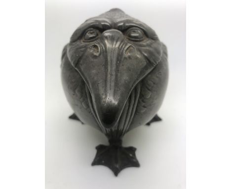  A pewter inkwell, attributed to Kayserzinn Jugendstil, Circa 1900 cast as a grotesque bird, with hinged lid enclosing cerami