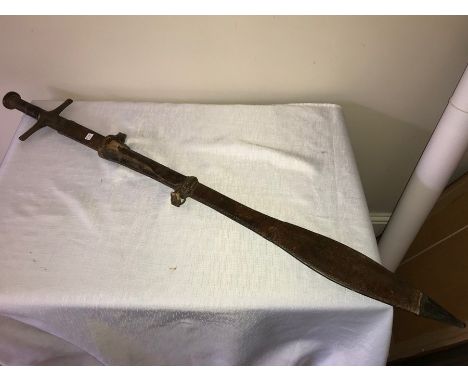 Sudanese Kaskara sword in tooled leather scabbard, the blade engraved with opposing moons. 
