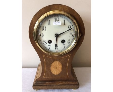 An Edwardian inlaid mantle clock. 17 w x 30cms h. 