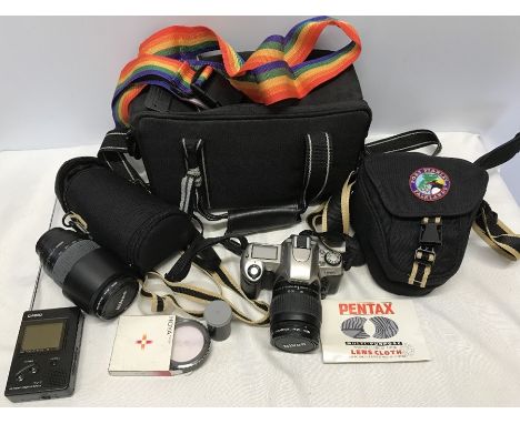 Nikon F65 camera with 28-80mm lens and carry bag, also Nikon HB26 lens, Hoya filter, larger carry bag, together with a Casio 