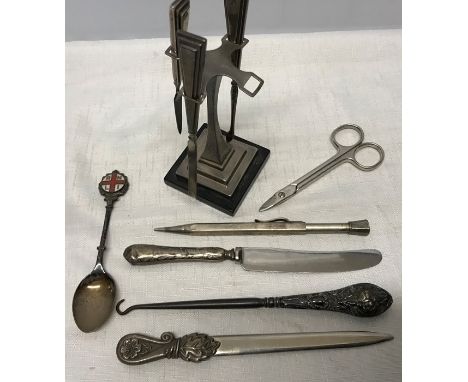 Art Deco silver manicure set on stand, missing scissors, silver RNLI spoon, silver propelling pencil, silver handled button h