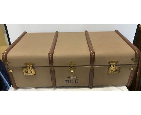 Large metal bound travel trunk, maker Norton, initialled to front MGC fitted with inner tray. 