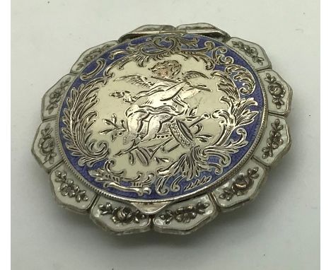 A good quality white metal and enamel compact marked .925, 6cms d.