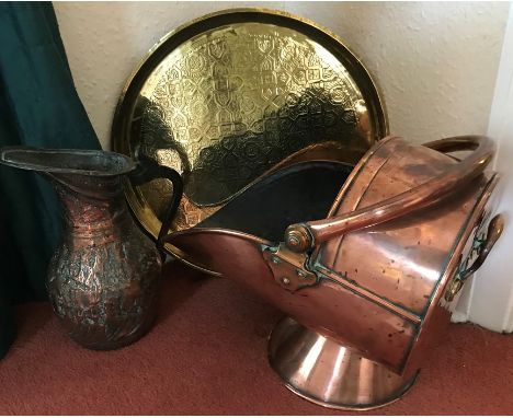 Brass circular plate, Victorian copper coal helmet and a copper jug. 
