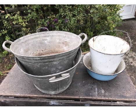Two galvanised washtubs, enamel bucket and bowl. 74cms largest, hole to one.  