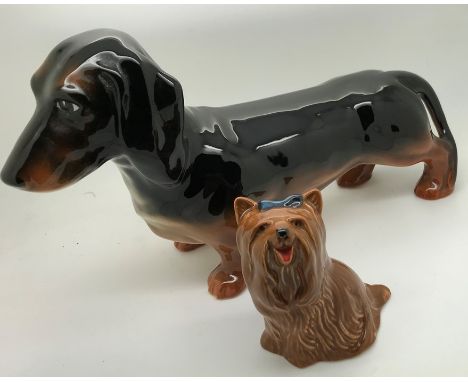 Two Beswick pottery dogs, Dachshund and terrier with two Briglin studio pottery animal money boxes. Largest 17cms h. Conditio