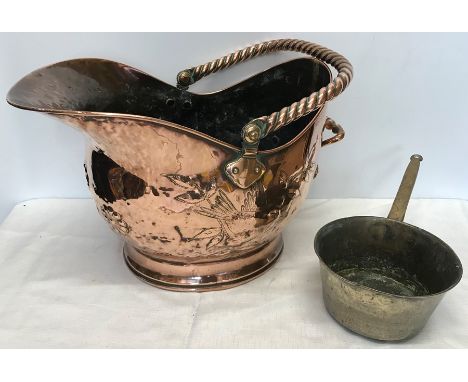 Copper coal helmet with embossed bird and floral decoration, rope twist handle together with a small brass jam pan, 18cms. 
